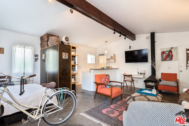543 Grand Boulevard C Venice, California This private, spacious, and very loft-like studio is just blocks to Abbot Kinney, the Canals, Venice Farmers Market and the beach. Enjoy your own private patio too! This is a lower rear unit of a hip and modern triplex that doesn't have anyone above or below you -- so enjoy lots of privacy, character and charm. There are polished concrete floors throughout (fun & easy to clean), a high open beam ceiling, and lots of windows for lots of light.The floor plan is great, you create the transitions between living room, bedroom, dining area & kitchen (see photos with furnishings for ideas). The kitchens sleek countertop/bar table are a nice contrast against the clean white walls and appliances -- fridge & stove included.A small private patio out front with fragrant jasmine climbing the fencing adds to the very cool Venice beach vibe. The property is completely fenced -- there is even a shared front grassy yard with gas grill, & there's free laundry on site. Street parking only.