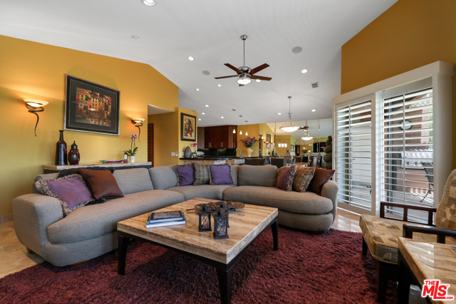 42464 Sultan Avenue Palm Desert, California This is truly a must-see, beautifully updated and decorated in 2004, furnished, turnkey, golf-course home in Oasis Country Club. Pride of ownership shows throughout the unit. This home features purple carpeting and marble floors, rich fabrics in the 3 bedrooms, plantation shutters in every window (even in the garage window), lovely light fixtures, attractive artwork, and lots of comfortable furniture. There's a wine cooler in the kitchen, and an additional refrigerator/freezer in the garage; where the golf cart is parked. There are peek-a-boo mountain views from the large patio overlooking the golf course.