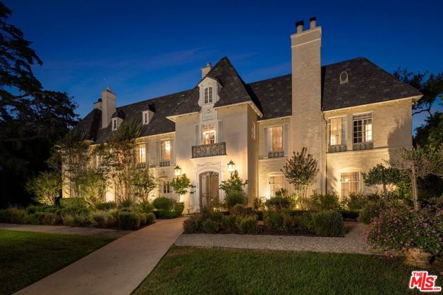 355 S Rimpau Boulevard Los Angeles, California This elegant, historic chateau is an iconic estate located on one of the most desirable streets in Hancock Park. The trophy 6BD8BA property combines 1.5 original lots for a total of 32,000SF. A true entertainers paradise offering a premier living experience and tastefully reimagined to offer modern amenities while embracing the original charm & architecture. Enter through a dramatic foyer leading to many highlights including sensational living & dining rms, chefs kitchen, wood-paneled library, and exquisite garden bar that opens to the spacious backyard with multiple dining al fresco areas. The master suite is the ultimate escape w/ cozy sitting room, gorgeous bathroom & balcony overlooking the gardens and featuring an indoor and outdoor shower. The sprawling grounds boast a swimmers pool & spa, outdoor fireplace, dining area, vegetable, citrus & cutting gardens, olive grove & reflection pond all privatized by mature landscaping. To finish, find a beautiful guest suite w/ full bath & kitchenette. This is a rare opportunity to own a gem in a highly coveted area, moments from the best dining & entertainment in LA.