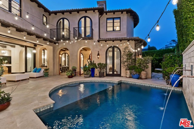 753 Chapala Drive Pacific Palisades, California Situated in the Huntington Palisades, is this exceptional blend of design, taste and tranquility by renowned architect Doug Burdge. Five bedrooms, nine baths, over 7,000 sf of luxury with imported Limestone, French oak floors, custom details, exposed wood beams and dual staircases. A gourmet kitchen, butlers pantry, formal dining room, living room, great room and indoor/outdoor loggia gives the perfect balance of open space and intimate retreat. The lower level enjoys a wine cellar and tasting room, media center, bonus room and space for the home-gym. Upstairs a romantic master retreat with dual walk-in closets, dual baths, a fireplace and Juliette balconies overlook the pool courtyard. Four more bedrooms, lounge space and wood paneled library round out this level. Outside, the private garden setting includes a pool with Baja shelf and fountains, a spa, outdoor kitchen and sports court. Located just moments from all the dining, shopping, nightlife, and culture the Village offers.