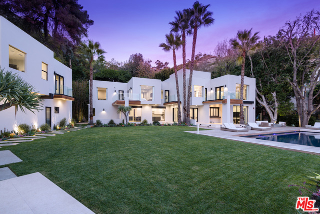 1651 HASLAM Terrace Los Angeles, California Set behind gates located on a private cul-de-sac above the Sunset Strip, this recently remodeled compound showcases true luxury and style. With the utmost privacy, the home is set on a ~26,000 square foot lot boasting 7,316 square feet of custom living space. Designed with the utmost attention to detail the home features several living rooms, a dining room, chef's kitchen, dining area, bonus room, and office. Featuring 5 bedrooms in the main house, and another 2 in the Guest House, the property has a total of 7 bedrooms and 7 bathrooms. The Master Suite is complete with a private balcony and a beautiful bathroom composed of a large shower surrounded by glass and a free-standing tub set before a window framing the city views. The stunning panoramic views are displayed from all areas of the outdoor space hosting a beautiful infinity-edge pool and a BBQ area surrounded by lush landscape.