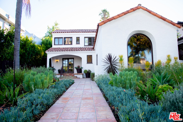 317 S Oakhurst Beverly Hills, California $100,000 Price Reduction! Motivated Sellers! Charm abounds in this beautiful space called Home! Sun-soaked living spaces throughout, with hardwood floors in all major rooms. Enter a spacious Foyer that takes one to a dramatic Living Room with exposed high-beamed ceilings, a gorgeous fireplace, and an arched window looking out to a succulent-landscaped front yard. A Formal Dining Room with French doors open to a Gourmet, Center Island Kitchen that's fit for a fine chef, and a large Breakfast Room w/ built-ins galore! Downstairs Den with a Wine Cellar, and a 4th Bedroom/Office/Maids Suite. Upstairs is the Primary Bedroom Suite, w/ an adjoining rm w/ built-ins that works for a dressing rm/gym/ nursery/study. A walk-in closet that in itself could be another bedroom! 2 additional Bedrooms Suites upstairs. Pool, Patio, and extra outdoor space make this home complete! Highly acclaimed Beverly Hills Schools. Minutes to posh Beverly Hills shopping & fine restaurants. Show and Sell!