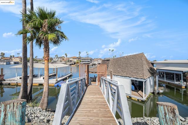 Dock with a water view and a residential view