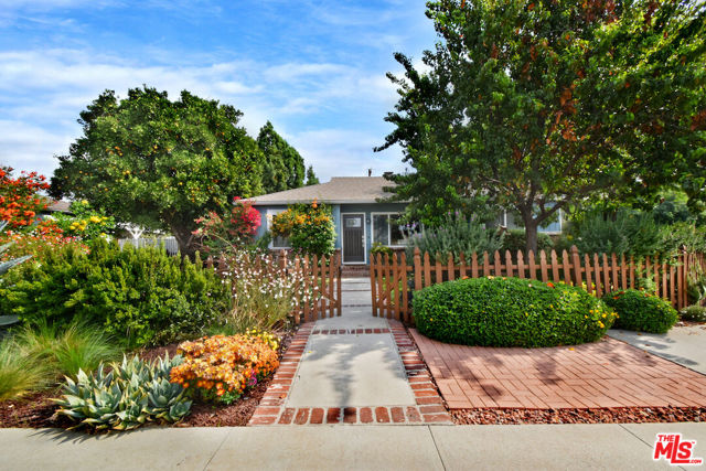 C. 1948. Charming Valley Ranch w wood picket fence, mature landscaping, stunning exterior w renovated interiors located in one of Valley Glen's most desirable, median protected locations. Sunset facing entry opens to light filled large living area w fireplace, dining area, large den, laundry room and gorgeous, remodeled, quartz countered kitchen w stainless style appliances. Private, off main living area, ample sized primary bedroom, central remodeled full bath and two more generous secondary bedrooms. Well appointed, remodeled second full bath off main area may act as powder as well. Large comfy den opens to wonderful  grass rear yard w very large, detached, covered (sorta magical) entertaining pavilion / open-air room. Perfect for large family gatherings, catered events, outdoor living room etc... Also nearby, a fully detached two-car garage (future ADU?) w nice side space for possible small vehicle / storage etc...Big enough home to leave alone, large enough corner lot to expand, enhance, value add etc...Simply a wonderful property w plenty to enjoy and room to grow in one of Valley Glen's most desirable neighborhoods. A 10+ :-)!