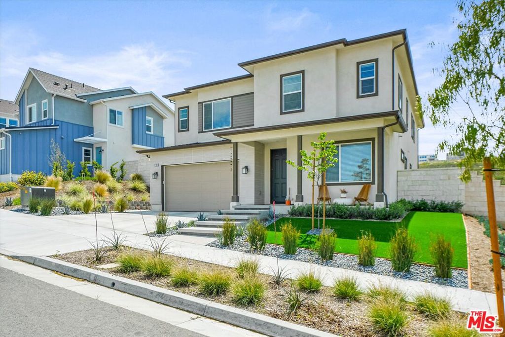 Experience elevated living in one of Valencia's most exclusive enclaves Sage at FivePoint Valencia. Built in 2023, this stunning 5-bedroom, 3-bathroom single-family residence seamlessly blends modern sophistication with designer-quality upgrades with a coveted indoor-outdoor lifestyle. A dramatic entryway welcomes you with an illuminated floating staircase that immediately captures the eye and sets the tone for the refined design found throughout the home. Inside, no expense was spared, enjoy upgraded quartz marble countertops, custom cabinetry, premium tile, flooring, and a full suite of top-tier Wolf / Sub Zero appliances. A spacious walk-in butler's pantry with wine and beverage center adds both convenience and wow factor. The expansive great room opens to an oversized, meticulously landscaped backyard oasis with dramatic floating black marble LED fireplace and a covered patio for year-round enjoyment, ideal for entertaining and enjoying the picturesque mountain views. The primary suite exudes luxury, featuring a spacious sitting area, dual walk-in closets, and breathtaking mountain views. The spa-inspired ensuite bath is equally impressive, with a massive rain shower, Soaking tub, premium finishes, and a serene, resort-like ambiance designed for ultimate relaxation. Additional features include upgraded insulation, owned solar panels and EV charging station. Residents of FivePoint Valencia enjoy a vibrant lifestyle with access to resort-style amenities, including pools, luxurious cabanas, clubhouses, playgrounds, BBQs, community gardens and miles of paseos and biking trails. The community also hosts local events, food truck nights, seasonal festivals, and outdoor concerts all just minutes from top-rated schools, shopping, and dining. This is more than a home  it's a statement.