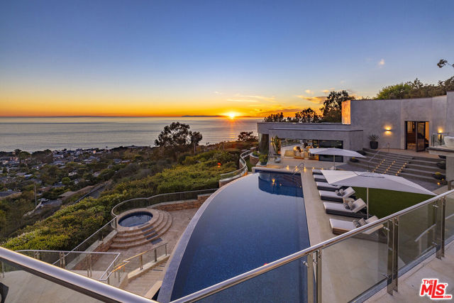 Situated just minutes from the prestigious Montage Laguna Beach resort and less than a mile from some of the most scenic and secluded beaches in Southern California is this unparalleled estate. Displaying spectacular articulation of light, space, and fine design, set amid 12 unobstructed acres of native California landscape, this thoughtfully constructed estate property is enveloped by breathtaking views of the Pacific creating a harmonious connection between its refined interiors and the surrounding environment. The epitome of luxuriant California living wonderfully scaled spaces open to expansive terraces, a sparkling resort-like pool, and entertaining veranda. Every consideration was accounted for when composing this sophisticated property with the leading technological advancements in home automation; a multimillion-dollar fire suppression system; a state-of-the-art theater, elevator, facilities for multiple fitness activities, five primary-like bedrooms with en suite baths, a myriad formal and informal rooms for living and hosting guests; and interiors graced with the vision and finish selection of an Architectural Digest Top 100 designer. One of the region's most significant architectural presentations. The property's intrinsic benefits of arguably equal value have optimal proximity to the area's finest amenities while offering abundant open space, and nonpareil privacy, all affording a lifestyle beyond compare. Sale includes APN #658-03-11.