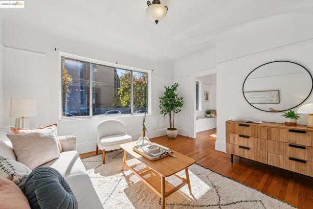 Living room with wood finished floors and baseboards
