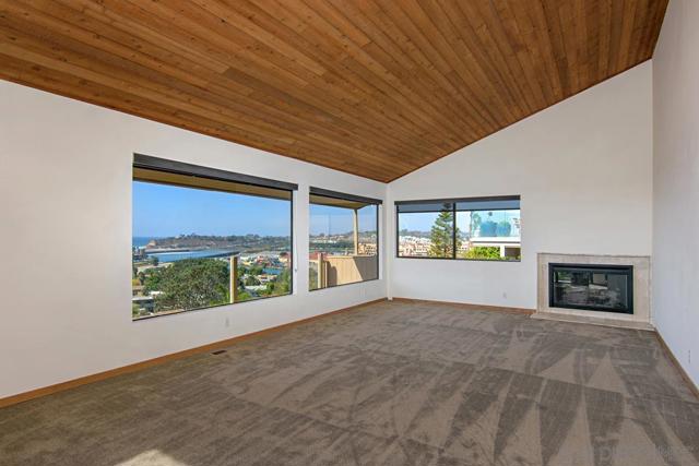 Fireplace and 180 ocean views from the living room.