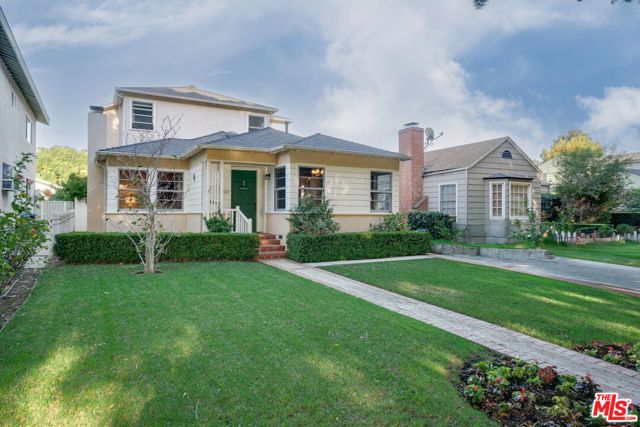 1057 Yale Street Santa Monica, California Charming Traditional home in the lovely North of Wilshire, Franklin School neighborhood. Super cute and cheery! 3 bedrooms + 2 baths, approximately 1,800 sqft with an enormous backyard! Hardwood floors, wainscoting, built-ins and a brick fireplace all add to the character of this sweet home. Generous living room, formal dining, a nice kitchen space for the home cook and two bedrooms downstairs! Upstairs there is an open den adjacent to the primary bedroom with fantastic natural light. The large grassy backyard gets incredible sun and provides a covered patio for enjoying meals outdoors in our beautiful SoCal weather! A room off the detached garage (an additional 219 sqft) would make a great office or gym- or build an ADU with access via the alley! Franklin School District. Move-in ready or update and expand!