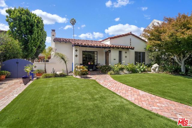 722 21st Street Santa Monica, California The charm and beauty of a 1930s Spanish home with all of today's desired amenities. This lovely single-level home is gated and surrounded by privacy hedges creating a peaceful and private retreat. Exceptional natural light fills the home through large windows and multiple skylights. High-ceilings, graceful custom archways, hardwood and tile floors further enhance the generously-sized rooms. The vaulted, beamed-ceiling living room features a fireplace. A large chef's kitchen with center island, stainless-steel appliances and farmhouse sink opens to the formal dining room. The large primary bedroom opens completely to the backyard while being fully screened for those who enjoy indoor/outdoor living. A fully appointed walk-in closet and naturally lit bathroom with oversized soaking tub complete this stunning sanctuary. There are three bedrooms located inside the main house plus an additional two-room, full bath suite in the detached converted garage. A covered outdoor "family room" extends the living space into the backyard. Currently planted with drought-conscious desertscape and tiled patios, there is plenty of space to create your own personal oasis on the 8,962 sqft lot. Upgraded systems include central air conditioning, tankless hot water, back-up generator and electric vehicle charging. Located in Franklin School District and near both the Brentwood Country Mart and Montana Avenue's shopping, dining and cafes. This romantic, single-level home has that special "wow" factor you've been waiting to find.