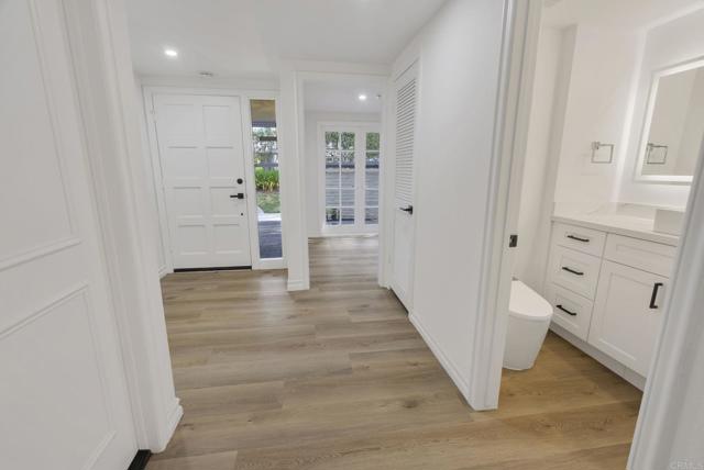Inviting Entry!  Roomy Hall Closet.  Door leads down to XL Attached 2 Car Garage w/multi built in's!