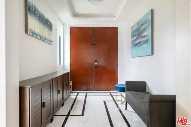 Main entrance of the home with seating areas and cabinet space