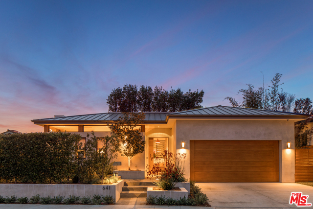 641 Jacon Way Pacific Palisades, California Rare offering! Mid-century inspired one-story custom contemporary home built in 2013 with 10-foot ceilings and commanding ocean views situated in the lower Marquez Knolls of Pacific Palisades, close to the beach, hiking, schools & Palisades Village. Flooded with natural light & cool ocean breezes, this home was an original project by the acclaimed highly sought-after local design/build team of Eliana and David Rokach. Sophisticated in style but extremely functional for everyday California living where the indoors meets outdoors. First, a wall-to-wall great room opening that connects to a large-scale flat grassy backyard with views. Second, two glass atriums, one featuring a handcrafted water feature & stairs that lead up to an 1,800 SqFt rooftop deck with explosive ocean, mountain, city lights, Queens Necklace & Catalina views. A single level home with interior atriums & rooftop deck, creating a one-of-a-kind space where the hub of the home is in direct sightline of the rooftop deck.