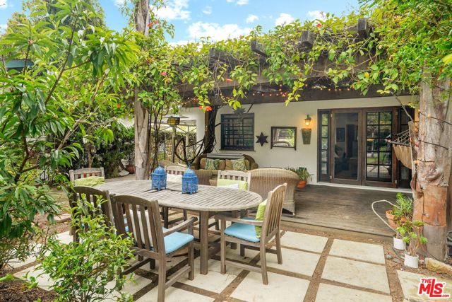 522 Indiana Avenue Venice, California Spanish compound with a spectacular garden featured in the Venice garden tour on numerous occasions. Located blocks from famed Abbott Kinney and Rose Ave. Spacious and light filled 3 bd 2 ba has a large open floor plan with a recently remodeled kitchen with granite counters, farmhouse sink, marble backsplash, breakfast bar, Stainless steel appliances and wine refrigerator. Breezy Master leads to back secluded patio area through French doors complete with children's play house surrounded by bamboo. Remodeled master bathroom with marble counters and twin sink vanity and large walk in closet. Light filled living room leads to large wood deck with Trumpet flower vine canopy overlooking a lavish garden complete with citrus trees, vegetable garden and buffalo grass lawn. Too many exotic plants to list. A truly relaxing and harmonious property. Large RD1.5 Lot so room to expand in the future or ADU. Exceptional Airbnb history, just call and ask! Not only is this a great place to call home but a great investment that will bring you huge returns.Use as a vacation rental income producing home, or a 2nd home near the beach!