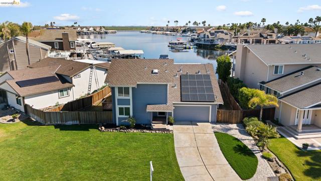 Aerial view of residential area with a nearby body of water