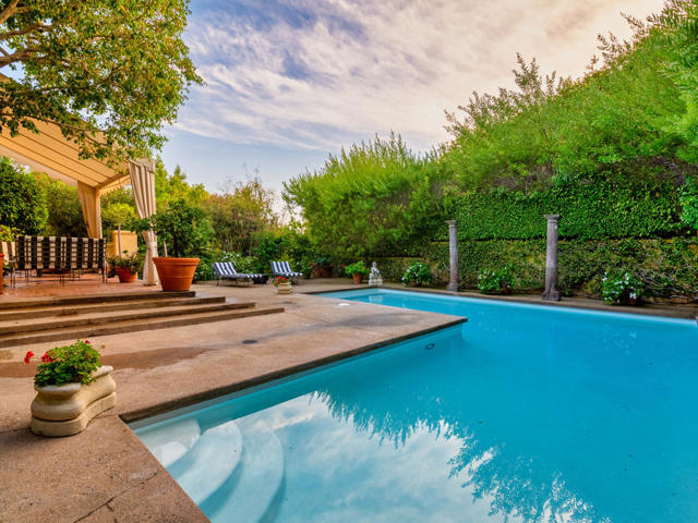 1253 Delresto Drive Beverly Hills, California Feel the Luxuriousness of living in one of the most sought after properties In Beverly Hills. Designed by renowned Architect Bob Ray Offenhauser specifically for Fashion Designer David Hayes, one of the biggest names in Fashion in the eighties and nighties to all the famous women in Hollywood. Not to mention David was Nancy Reagan's favorite designer during her 8 year term as the First Lady. Rarely do you find a home that offers a once in a lifetime opportunity to have two famous designers that created and resided in this stunning historic masterpiece.The impressive unique facade features ivy-covered frontage and an expansive close to 1/2 acre lot with an attached two car garage. Extremely private property with remote controlled private gated entrance with 8ft. wrought iron fencing surrounds the mature landscaping to give you the utmost privacy. This stunning updated 3 bedroom 5 bath 3737 sq. Ft. European style property demonstrates the era that never goes out of style. The richness of the French and Asian decor and the uniqueness of the architect with its famous 'Bob Ray' signature style throughout this primarily single story home is magical.