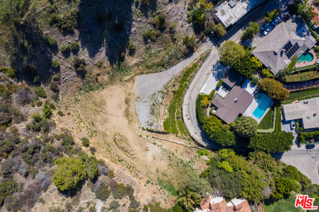 Spectacular view site with tremendous potential on approx 1.5 acres or approx. 64,964 sq.ft. in the prime Crest Streets just above the center of Beverly Hills. Huge flat pad featuring stunning canyon and city views. A truly incredible development opportunity. The perfect site to build a sprawling 1-story or 2-story estate.