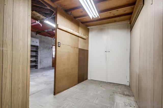 Small room in garage could be a great office or easily removed!
