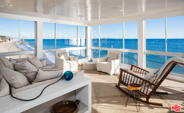 Luxurious living at its finest from this stunning oceanfront property. Located on Carbon Beach in the famed "Outrigger" this complex offers a private sandy beach and heated pool/spa, while conveniently located near Nobu, Soho House, Malibu Pier and much more for the utmost in resort style living. Floor to ceiling walls of glass offer unobstructed breathtaking ocean and coastline views from all rooms, including the spa-like master bath. Lay in bed while enjoying the incredible sunset views as you fall asleep to the sound of waves crashing below. This sun drenched two bedroom, two bath unit features custom French white oak floors and high end finishes throughout. The seamless indoor/outdoor design opens to a fire pit patio perfect for enjoying the summer evenings.  Tenant occupied, need notice to show.