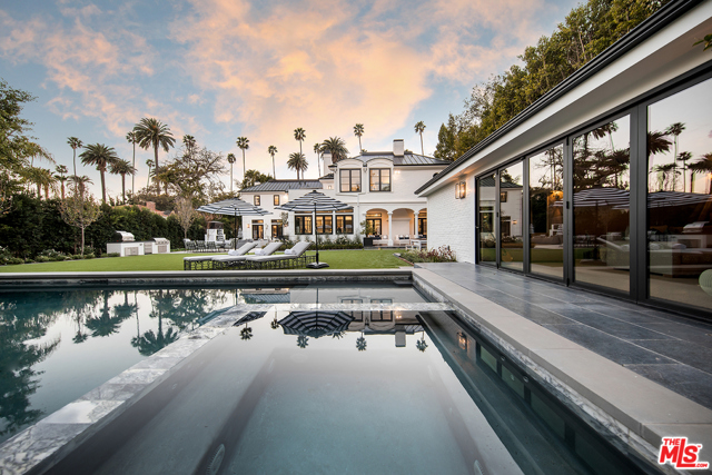 610 N Canon Drive Beverly Hills, California Luxurious, impeccable, exquisitely rendered Traditional home with a European soul in the heart of Beverly Hills. A superbly detailed home rich in craftsmanship and curated materials in a gated, beautifully manicured environment offering privacy, beautiful grounds, large pool, spa and guest house/gym, just a short distance to the shops and restaurants in town. Discreet from the street, the home is introduced with a stunning sky-lit entry, a focal point to the elegant stairway, formal dining room, office and step-down living room that doubles as a screening room incorporating integrated drop-down screen. Superb five en suite bedroom floor plan featuring sumptuous grand suite with office, terrace and extraordinary his and hers bathrooms, each with stunning marble showers and counter tops, sauna and custom closets. The gorgeous chef's kitchen is anchored by a giant Carrara Vena Florencia marble island, room-width banquette and is abundant with high-end appliances that integrate seamlessly with the fine cabinetry. A true gem for the most refined buyer. Shown by appointment.