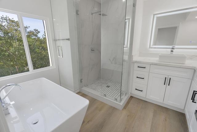 Spa Day is calling!  Custom Rainhead Shower, Roomy Soaking Tub, Backlit Mirrrors.  Dual Vanities!