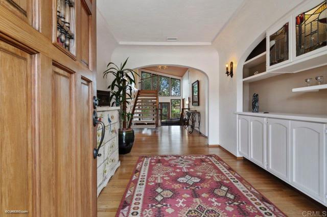 Foyer to split level home with canyon views