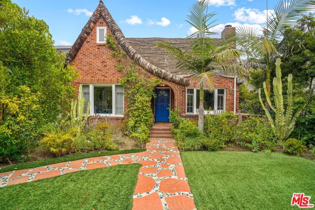 2214 Glyndon Avenue Venice, California Prepare to be enchanted by this storybook charmer brimming with surprises! Nestled behind private hedges in this quiet pocket of Venice, this 4 bedroom, 3 bath home feels warm and wonderful. Inlaid original hardwood floors, a wood burning fireplace, a sun-filled master suite with spacious 150sq balcony overlooking a sparkling pool and fruiting trees... it's hard not to imagine your happily ever after here. An inviting covered front porch leads you into the fireplace warmed living room adjacent to the dining room filled with windows overlooking the front garden. A large kitchen with breakfast bar opens to a 2nd family room, perfect as a homework den or tv lounge, and the 4th bedroom works perfectly as a home office with views to the backyard deck and pool. Upstairs you'll find the primary bedroom with its own balcony, along with 2 guest bedrooms one with rooftop views and one tucked under the rafters, with its own magical vibe. A large covered deck sits just outside for hosting pancake breakfasts or Sunday evening BBQs thanks to the built in grill station. Soak up the sun next to the luxurious pool, and maybe harvest some tomatoes growing in your raised organic vegetable bed. The carriage house showcases vaulted ceilings, skylights, a full kitchen and bath - the perfect fairytale ending.