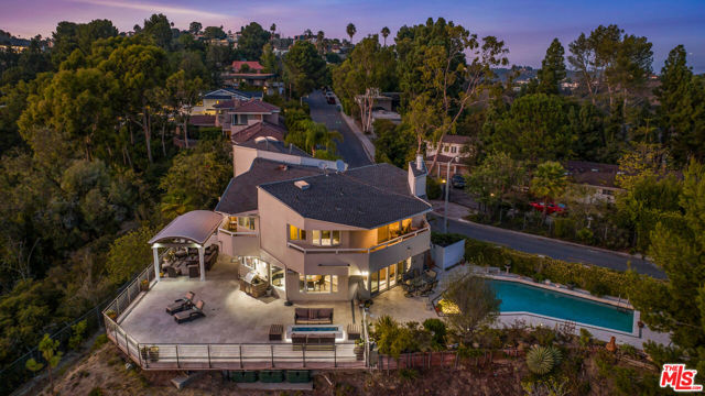 1121 Roberto Lane Los Angeles, California 10-Million-dollar view for only 6.5 million! First time on the market in 26 years. Modern Bel Air Estate on over an acre with stunning views and privacy. The 2 story home bathed in natural light throughout with a view from almost every room. The home has a breathtaking view of the ocean, city and canyons. The newly constructed (2016) 1,600 SF deck provides a resort-like outdoor entertaining experience. You can sit down early in the AM with your cappuccino reading a book under one of the gazebos while being entertained by the calming sound of birds or can jump into the swimming pool for a refreshing dip. On cold nights, you can enjoy the warmth of a custom designed fire pit that can accommodate 12 . The house sits on a double lot with infinite possibilities.