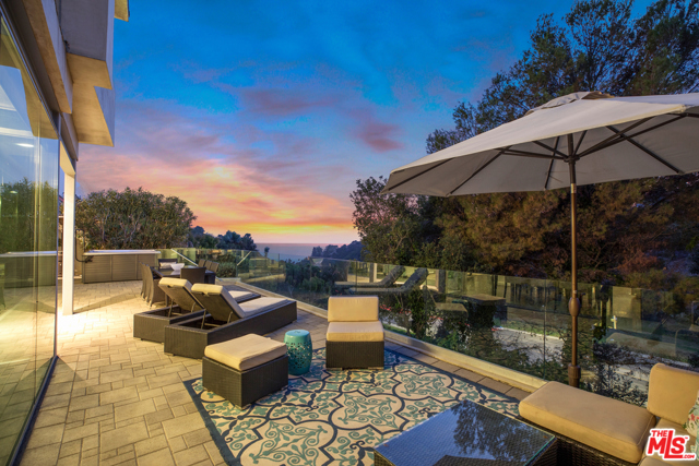 643 Radcliffe Avenue Pacific Palisades, California Settle in and marvel at commanding rear facing ocean and vista views from this warm contemporary home with modern features designed by award-winning architect Warren Techentin. It is secluded, walled and gated from the street, which creates a modern sanctuary of indoor/outdoor flow accented by floor to ceiling windows, Profilit structured glass and Fleetwood doors. Not only an entertainers dream floor plan on the main level, backyard with a star gazing hot tub and ocean breezes but there are also four bedrooms upstairs and one bedroom down plus a large family room. To say there is an abundance of natural light flooding the entire house would be a massive understatement! And to top things off, this setting is just moments to not only the all-new Palisades Village with boutique shopping, restaurants and movie theater but also award winning schools nearby by and steps to the ocean bluffs, beach, bike path plus hiking. All boxes are checked off with this amazing freshly remodeled home!