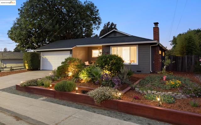 Ranch-style home featuring a chimney, driveway, a garage, and crawl space
