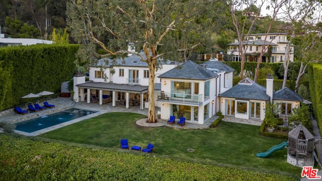 1711 Alta Mura Road Pacific Palisades, California Hidden behind a discreet hedge at the top of the Palisades Riviera, this Napa Valley-inspired trophy estate features unparalleled city, ocean, and Catalina views. Completely re-envisioned in 2010 by renowned architect Steve Giannetti, the nearly 7,000-square-foot residence has been redesigned to the highest levels of taste and finish. The home is set on an expansive, mostly flat, half-acre that exemplifies the California indoor-outdoor lifestyle with an expansive lawn, exceptional swimmer's pool, spa, outdoor loggia with fireplace, and breathtaking gardens - all flowing out to the dramatic dead-on views. Amenities include a chef's kitchen with island, gym, library, office, Crestron home automation system, and a two-car garage with gated parking for an additional five cars that doubles as a sport court. This offering represents a rare opportunity to enjoy a view estate of extraordinary quality and character on a spectacular lot.