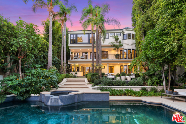 8 Oakmont Drive Los Angeles, California Built around the art of entertaining stands this magnificent trophy estate set on one of the most coveted, secure, and exclusive streets in Brentwood. Spanning over 11,300 sf and boasting oversized archways, grand-scale rooms, fireplaces, large picturesque windows & French doors that open to the park-like outdoor spaces. Gourmet kitchen w/ high-end appliances, 6-burner range, espresso machine, wine fridge, pantry, that flows to both the breakfast area & formal dining. Master wing w/ lounge, views, fireplace, wet-bar, walk-in closets & dual baths. Resort-like yard w/ pool, spa, lounge areas & meticulous landscaping. Other highlights include guest suites, wellness suite w/ sauna & gym, media room w/bar, wine cellar staff quarters, laundry room, elevator, 8 car garage & more. This gated and ultra-private luxury estate has been meticulously maintained and features some of the finest designer touches.