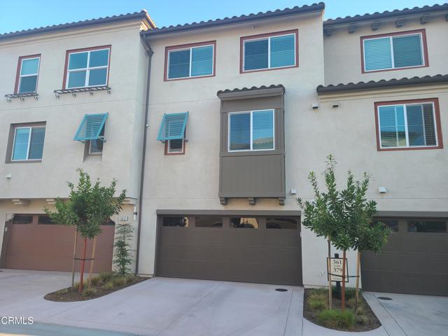 Rear with Two Car Garage and Driveway