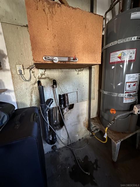 Water heater and washer, dryer hookups are in the garage.  Room for 2 cars plus storage.