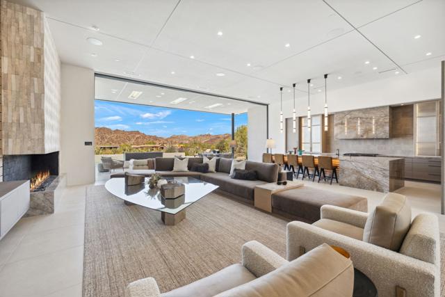 NEW CONSTRUCTION ~ Included IN PURCHASE are a 1-year cosmetic warranty and a 10-year structural warranty offered by Builder and designer furnishings. COMPLETED AND READY FOR MOVE IN. LOCATED IN THE RESERVE CLUB, Indian Wells -  Exclusive Desert Living: Located in the heart of the Coachella Valley's most pristine expanse of desert native landscaping, lies The Reserve, a private golf club and residential community. WHEN serenity IS CALLED FOR or a fast pace lifestyle filled with pickleball, golf & fitness, Members and their guests can have both. Casual and relaxed, yet refined and exclusive, The Reserve is a place to be YOU. This stunning contemporary home, built by Foxx Curci Construction & Angela Wells Interior Design, offers 5 bedrooms, 5.6 bathrooms, and 5,876 sq ft of interior space, PLUS an additional 1,335 sq ft of covered outdoor living. A high-efficiency HVAC system with six zones and seven AC units ensures year-round comfort. The 4-car garage, measuring 1,355 sq ft, is equipped with two ductless AC units.Enjoy the benefits of owned SOLAR SYSTEM and LED lighting throughout. The home features remote-start fireplaces and fire features both inside and outside, as well as motorized shades and custom cabinetry. A custom bar and an adjacent, convenient, temperature controlled, walk-in wine room with lateral bottle storage make entertaining effortless. The outdoor entertainment center includes a customized TV, recessed heaters, and a mist system to ensure comfort in any season.With high end finishes and a Smart Home Crestron Automation system you can control fire & water features, pool/spa, motorized sliding doors (great rm/primary & dining), lighting, shades & sound system. The kitchen boasts top-of-the-line Dacor appliances, along with a custom coffee station in a very large walk-in pantry with a full-size fridge. Throughout the home, 36x36 porcelain flooring adds a clean, contemporary touch. HOA dues include spectrum cable, 24 hr security, common area maintenance & golf course maintenance. Amenity list offered upon request.