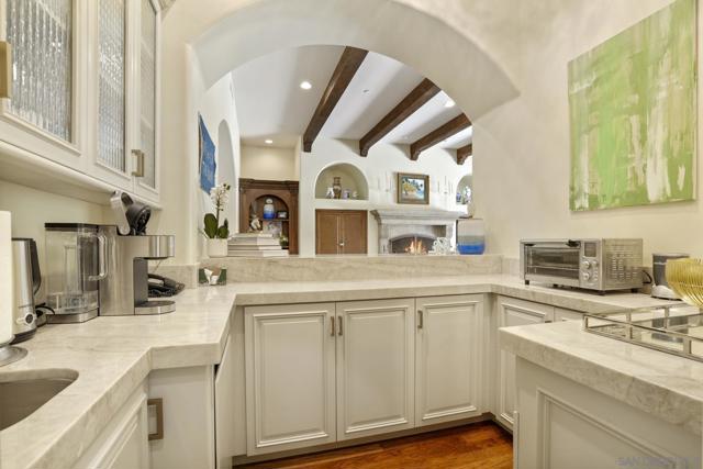 Beautifully remodeled, this functional wet bar serves the family room and makes entertaining easy.