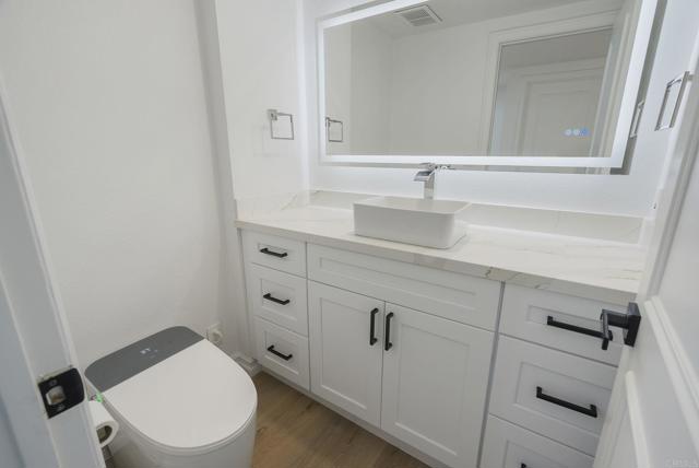 Main Level 1/2 Bath: Complete w/GORGEOUS Vanity, Vessel Sink, Backlit Mirror & Bidet w/Remote