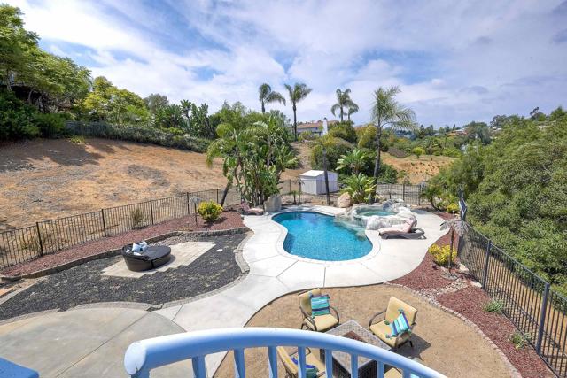 Spiral staircase leading to the pool area off the primary bedroom in the 1st home.