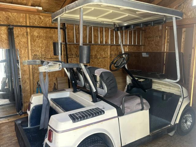 Chargeable golf cart in shed comes with