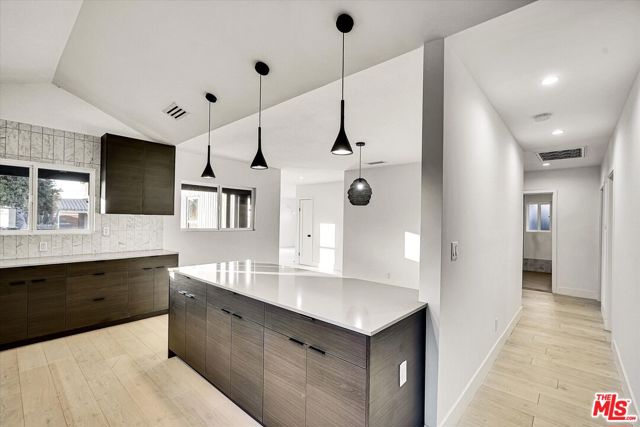 4122 S Bronson Avenue, Los Angeles CA: https://media.crmls.org/mediaz/37b2bb82-078b-454f-bc54-c8e072d2a00e.jpg