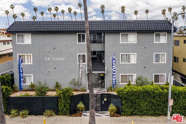 229 S Normandie Avenue Los Angeles, California 1988 construction 20-unit apartment building situated on a large 16,072-square-foot double lot| 4.5% cap rate on actuals, 5.29% at market | Spacious two-bedroom units with hardwood floors, granite counter-tops, full baths, walk-in closets, appliances, balconies, patios, and wall-unit air conditioning | Community amenities include gated entry, ample reserved parking, twenty-four hour surveillance cameras, and onsite laundry | The building has been well maintained with quality interior upgrades while the opportunity is available to add further value through strategic upgrades to the units and by generating income from parking | Subject only to State of California rent control with 5% + CPI rent increases | Well maintained and quiet building on the border of Koreatown and East Hollywood
