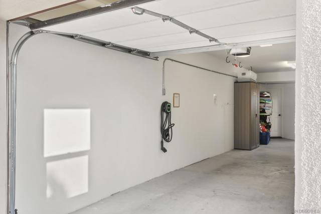 A spacious tandem garage offers secure parking and ample storage.