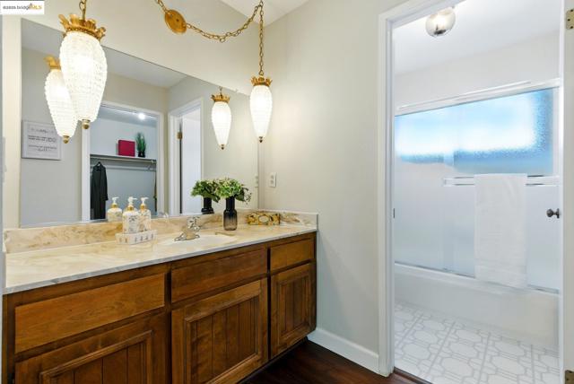 Full bath featuring vanity and a shower