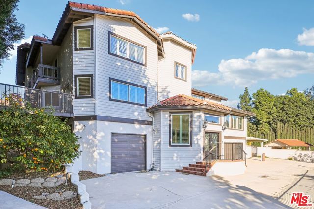 Welcome to this elegant property, featuring a tasteful neutral color paint scheme that complements the cozy fireplace in the living area perfectly. The kitchen is a chef's dream with all stainless steel appliances, an accent backsplash. The primary bathroom is designed for relaxation, boasting double sinks, a separate tub, and shower. The primary bedroom is complete with a spacious walk-in closet. Outside, enjoy the private in-ground pool, a patio, and a fenced-in backyard for privacy. This home is a perfect blend of style and comfort.