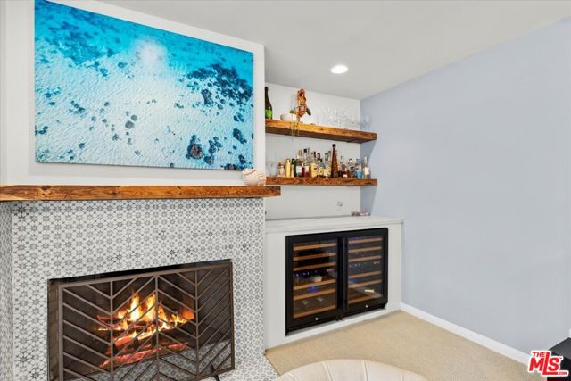 Fireplace and wine fridge off living area