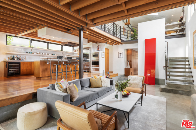 554 Westminster Avenue Venice, California This exquisite one-of-a-kind property has been re-imagined by esteemed local architects David Hertz and Charles Ward and is for the most discerning of buyers. With architectural features such as exposed wood beams and ceilings, sleek steel finishes, polished concrete and wood flooring, a loft-style secondary lounge area upstairs, and custom architectural glass doors and windows. Natural light floods into the open living and dining areas through the surrounding floor-to-ceiling glass windows and doors. The chefs kitchen offers an ultra-modern design using open shelving to accentuate the open atmosphere and provide plentiful storage. The primary suite comes complete with an open terrace that spans the entire width of the second story and looks out to the picturesque backyard, where youll find luscious greenery, and a beautiful spa and swimming pool. Also featured in the backyard is a second structure that serves as a bar and gym, and will have completed the plan check process for an ADU to have an RTI Ready To Issue status. Centrally located to Abbot Kinney, the beach, and all Venice has to offer, this private oasis is a must see!