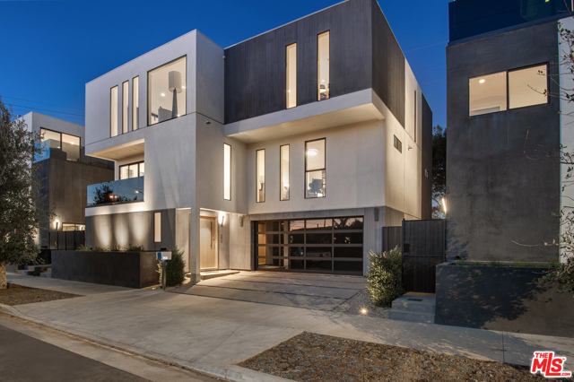 1900 Penmar Avenue Venice, California Be the first to put down roots in this modern coastal retreat fusing bespoke architectural details and high-end finishes with bright, breezy Venice Beach vibes. This new contemporary dwelling dazzles with a sun-filled floor plan designed to optimize calming views and natural light. A stylish oak pivot door leads to an en suite bedroom, with a sliding barn door, which can be used as a home gym or office. The large family room has access to the patio with eco-friendly lawn and lush landscaping. A floating staircase elevates you to the second level where the primary suite invites you to a spacious balcony, walk-in closet, and stunning bathroom with dual Italian vanities and a floating tub housed within a porcelain-clad shower. The level is completed by two additional en suite bedrooms with walk-in closets.The third level has a great room with a fireplace and a designer Italian kitchen featuring Fisher & Paykel appliances, built-in shelving, an island with wraparound breakfast bar and private oversized deck.Additional features include: two-car garage, wide-plank oak floors, smart home automation option, directional adjustable lighting, pneumatic elevator option.