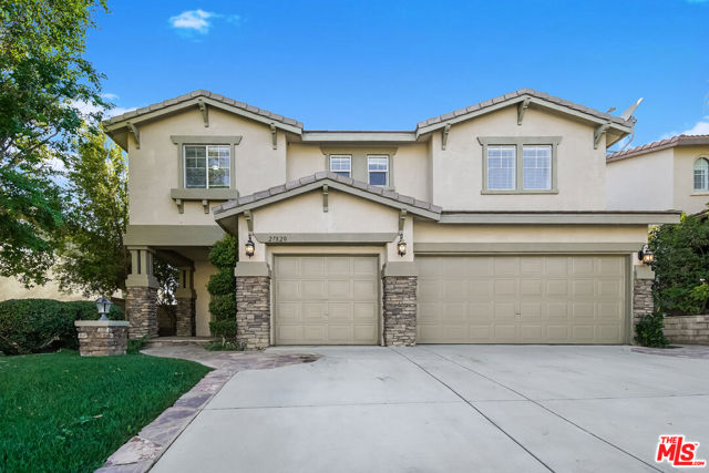 27820 Mariposa Lane Castaic, California This Castaic two-story home offers a patio, quartz countertops, and a three-car garage.