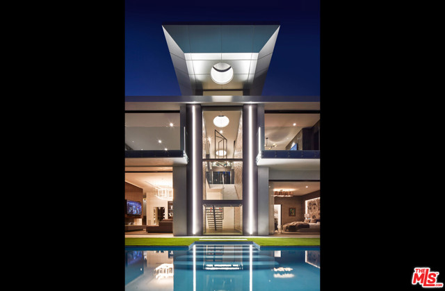 1 Bode Drive Los Angeles, California Nestled in a prestigious Hollywood Hills location awaits this striking, impeccably built contemporary estate designed by celebrity architect Michael Mueller. For the most discerning buyer, the home sits at the end of a private, gated street and is enveloped by explosive views from Downtown to the ocean. With a sweeping open floor plan and endless indoor/outdoor living, the compound is a true entertainers paradise. Each space is beautifully accented by sweeping balconies and disappearing walls of glass allowing for you to enjoy the mesmerizing vistas from nearly every room. Rivaling the most luxurious five-star resorts, the sumptuous master suite includes a dramatic two-story dressing room and decadent bath with soaking tub, dual showers, and make-up vanity. Additional amenities include library, high-end fitness studio, media room, well-appointed guest suites, three-car showcase garage, and so much more. Relish the beautiful California weather in the outdoor spaces which boast a sparkling infinity-edge pool, sprawling grassy knolls, al fresco dining areas and a roof top Sky Lounge with a breathtaking panorama view. A work of art in a world class locale, this gorgeous Hollywood oasis is secluded, yet just moments to iconic Sunset Strip and prestigious Beverly Hills.