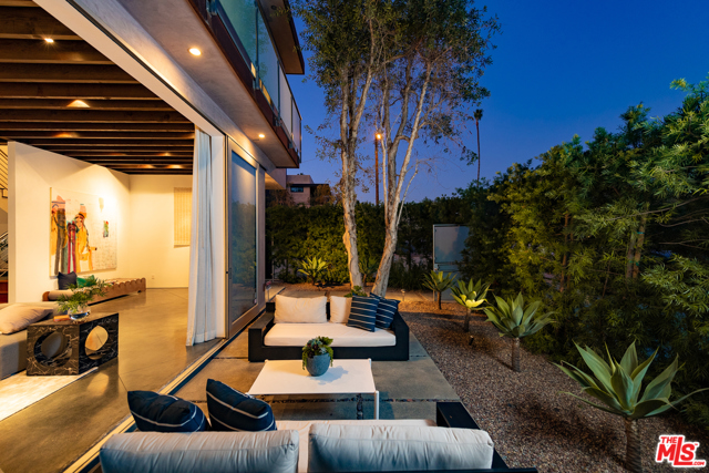 2405 Wilson Avenue Venice, California Location, Location! Situated on a beautiful olive tree-lined street in the coveted Silver Triangle, this exquisite contemporary home is in the heart of Venice and amongst some of the Westside's best. Well thought out, blending functional living and a warm palatte you will transcend into true SoCal living. //About this Home: Enter through the beautifully landscaped courtyard that offers the ultimate privacy and serenity. At the main level, you'll be greeted by open beam ceilings and sleek concrete floors that immediately impress. The sun-drenched living room with floor to ceiling doors and windows offer an indoor/outdoor flow. Enjoy the perfectly sized, formal dining space to entertain friends and family while listening to the peaceful fountain that is the centerpiece to the room. A chef's kitchen boasts stone counters, stainless appliances, and gleaming cabinets. // You'll Love: The grand master retreat to unwind and relax - complete with a sitting area, walk-in closet, fireplace, and views from your balcony deck. //The Neighborhood: A short stroll to Abbot Kinney, the Canals, and the Beach -- you have everything you need here.